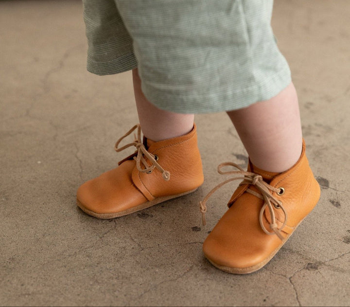 Soft sole leather baby boots in gender neutral ginger color.