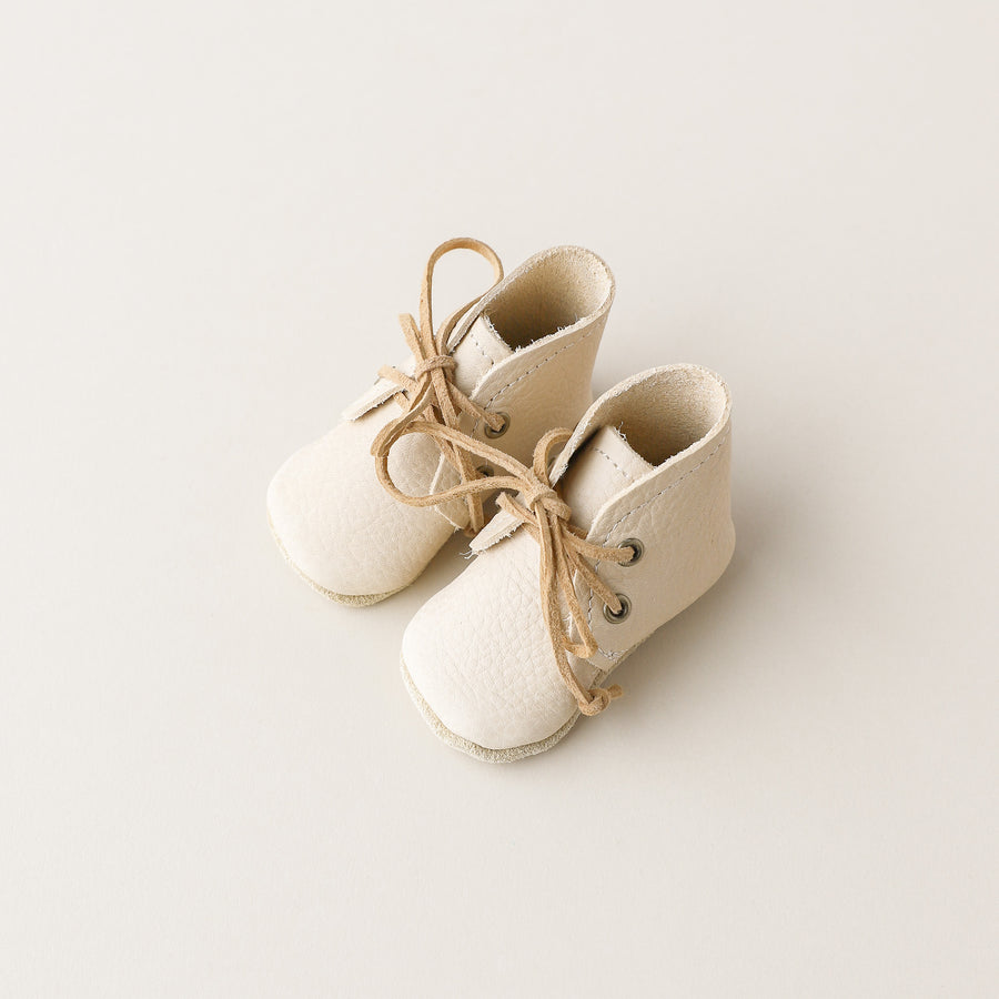 cream leather baby boots with soft soles. Suede laces. 