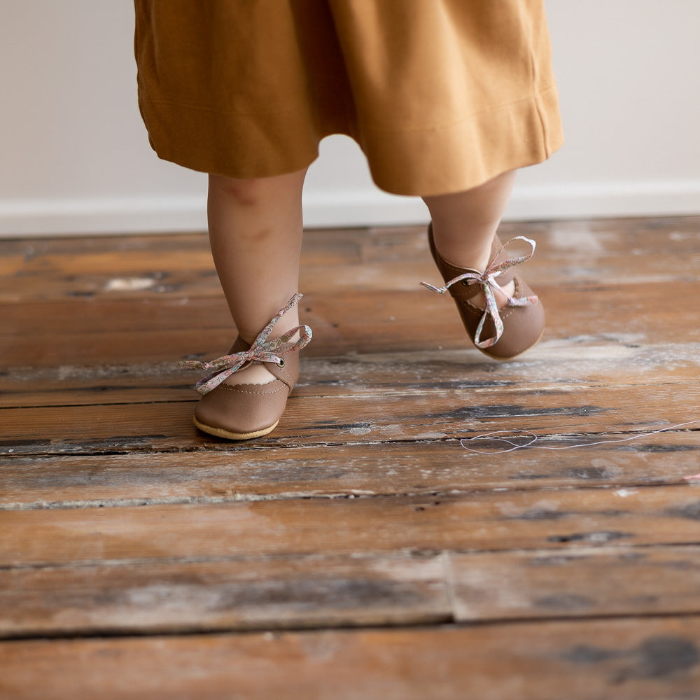 Sun & Lace Bella Janes soft sole shoes on little feet