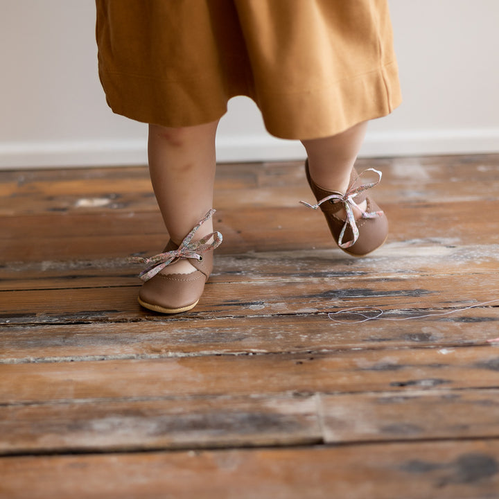 Sun & Lace Bella Janes soft sole shoes on little feet