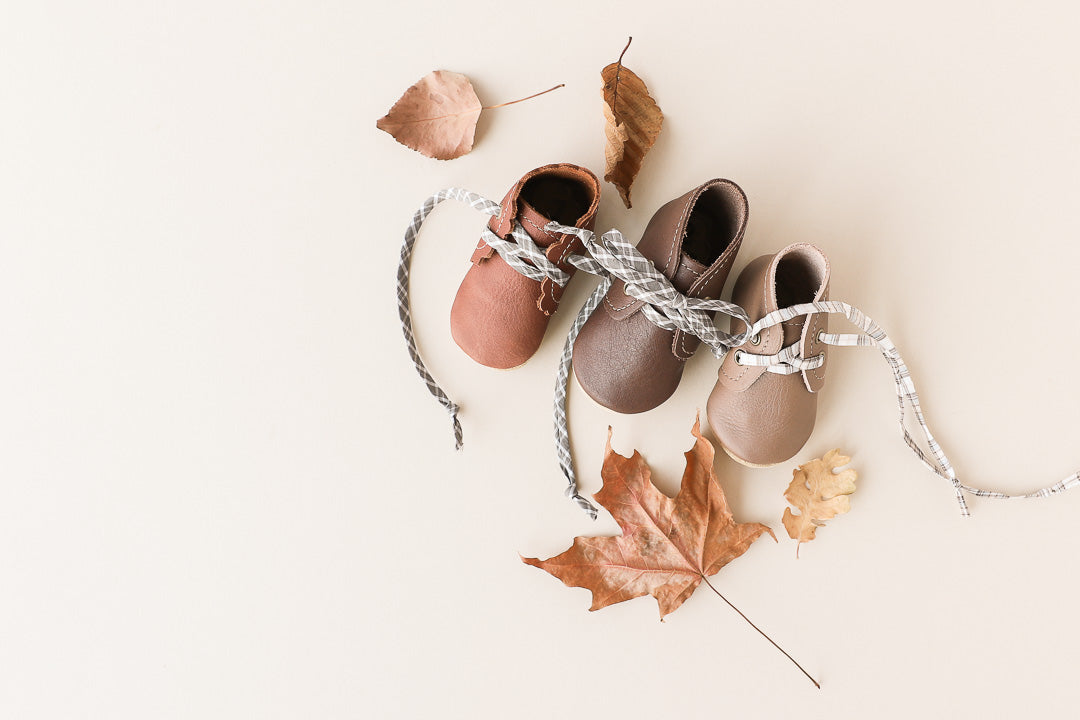 baby boots with plaid laces for fall family photos.