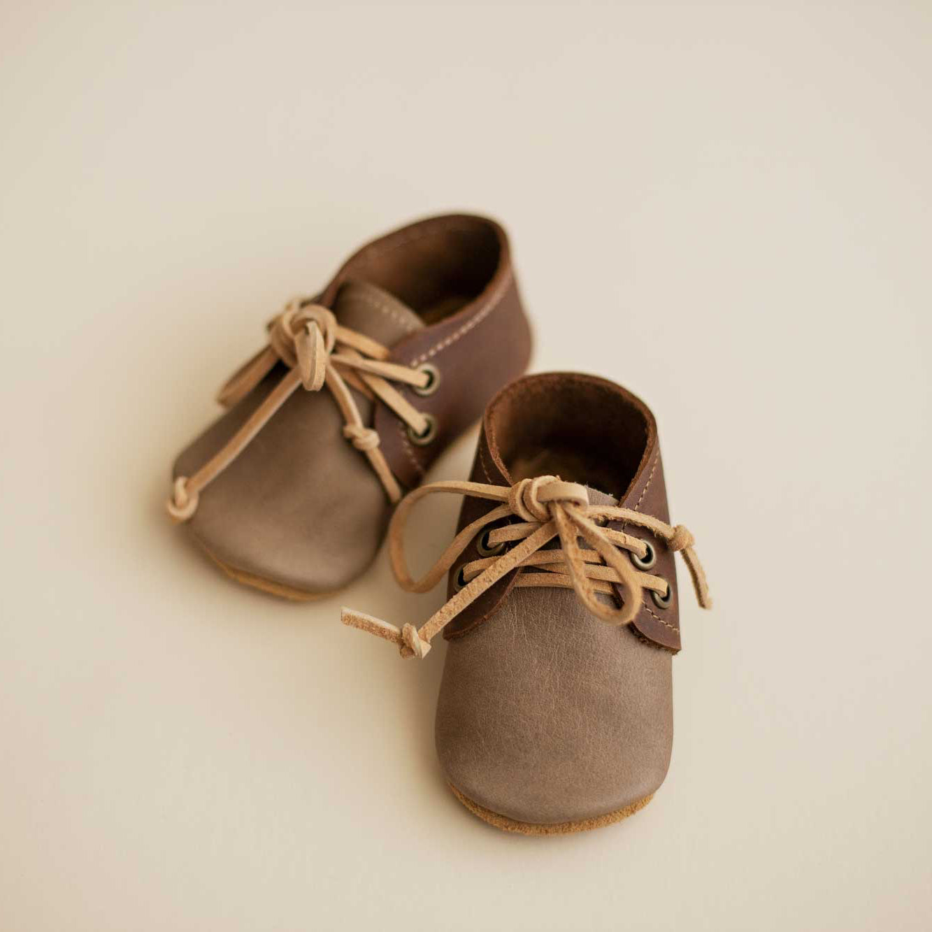product image of taupe and brown baby Oxford showing front of shoe