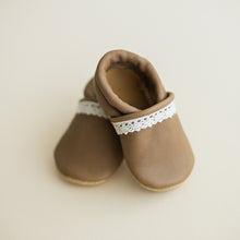 Taupe colored leather baby girl slip-on moccs. Ivory crochet trip. Suede soft-soles for new walkers.