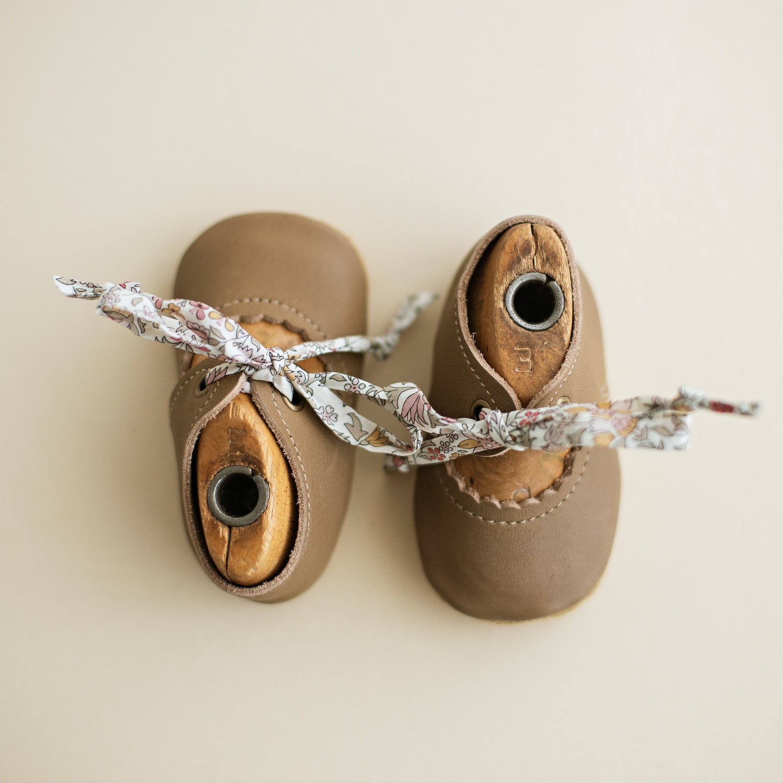 Taupe Leather baby girl tie Mary Janes. Sun and Lace Bella Janes for baby girls.