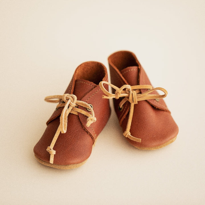 Auburn color leather baby desert boots with suede laces. Suede soft soles.