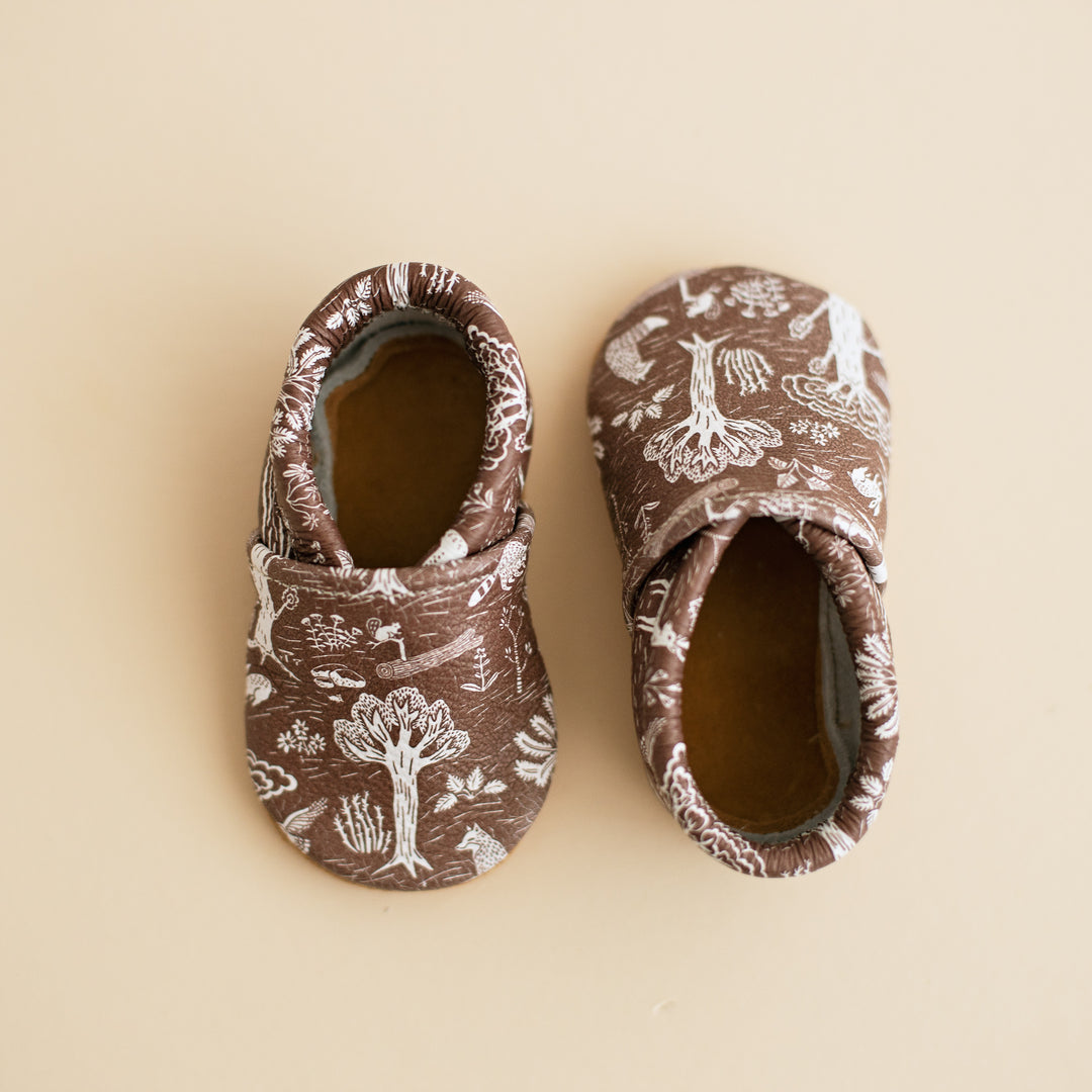 brown forest print baby moccs . gender neutral baby slip on shoes with elastic ankles