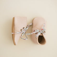 Pink leather baby girl boots with floral laces. Perfect for Valentine's Day outfits or a new baby gift.