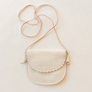 little girl's crossbody purse in cream leather.with scalloped flap