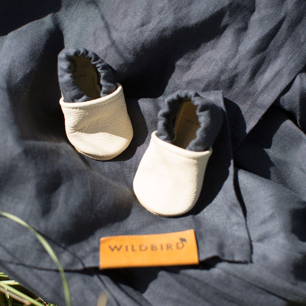 wildbird midnight baby shoes on carrier
